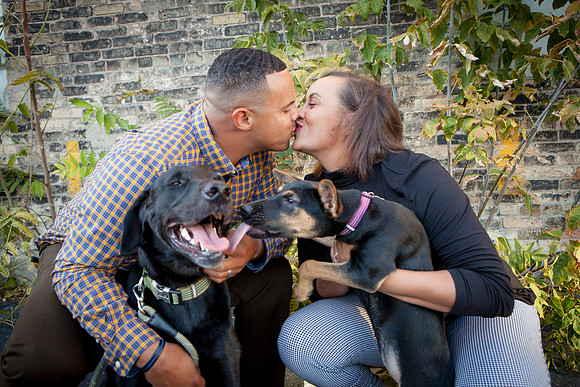 Puppy and couple kisses at Anodyne Coffee Roasting Company in Milwaukee