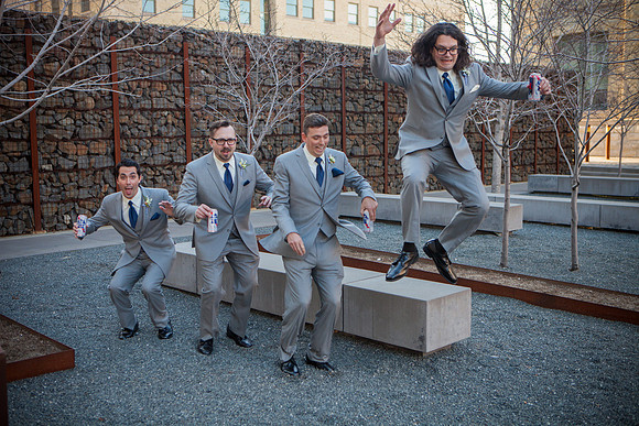 Groom jumps by Pabst Wedding Venue in Milwaukee
