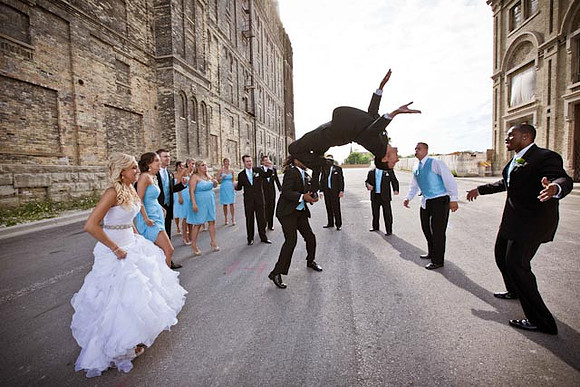 Jumping Bridal Party Photo in City Alley