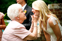 Grandma touches brides face lovingly